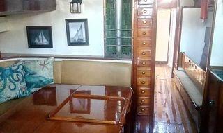 JADA settee and mahogany chest below deck