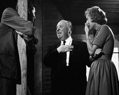 On-set promotional photo: Alfred Hitchcock directing Anthony Perkins and Janet Leigh during production