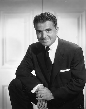 Portrait photograph of Jack Valenti, MPAA President from 1966 to 2004, showing a man in formal business attire against a neutral background